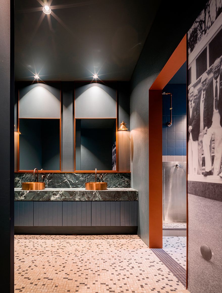 Revamped male and female amenities maintain original tiling
